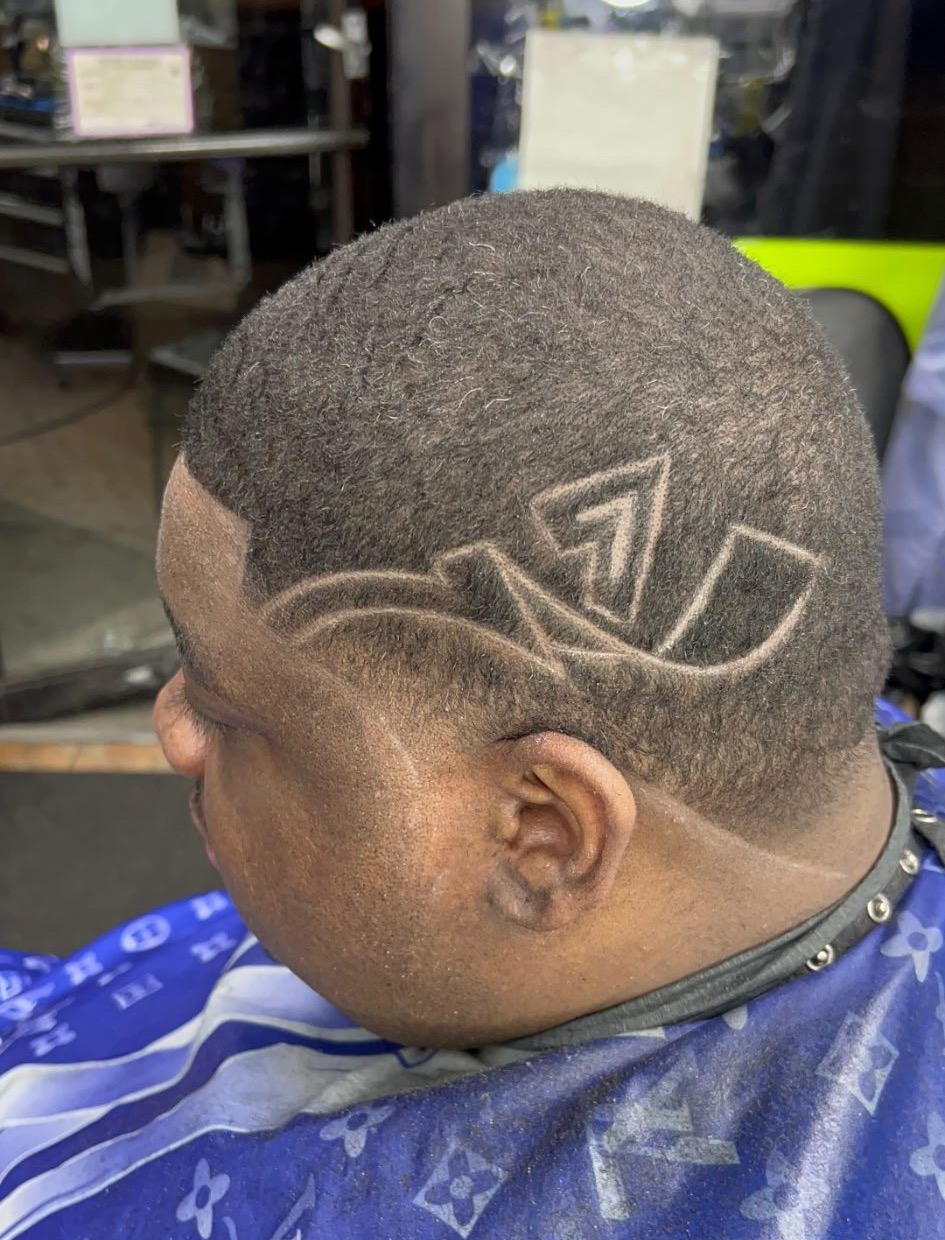 Geometric arrow design cut by Q